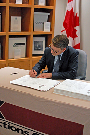 Chief Electoral Officer Stéphane Perrault signs the writs for the 43rd general election