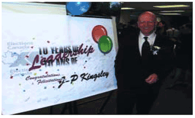 The employees of Elections Canada presented Chief Electoral Officer Jean-Pierre Kingsley with an anniversary celebration banner bearing their signatures.