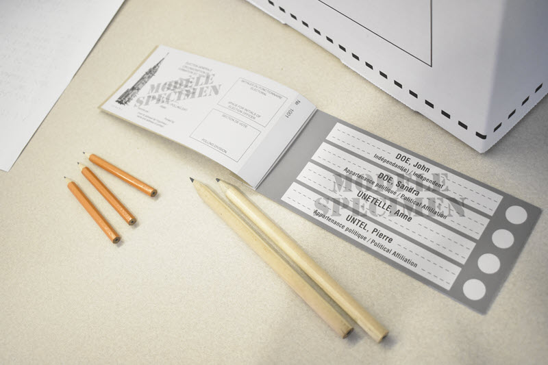 An Elections Canada ballot and pencils